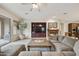 Cozy living room with fireplace, entertainment center, large couch and view to the outdoor patio at 2727 S Balboa Dr, Gilbert, AZ 85295