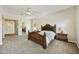 Main bedroom features a large bed, ceiling fan, and access to the walk-in closet and bathroom at 2727 S Balboa Dr, Gilbert, AZ 85295