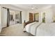 Bright main bedroom with carpet, walk-in closet and access to a private outdoor patio at 2727 S Balboa Dr, Gilbert, AZ 85295