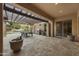 Spacious covered patio featuring an outdoor dining area, grill, and stylish desert landscaping, perfect for entertaining at 2727 S Balboa Dr, Gilbert, AZ 85295