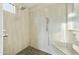 Modern walk-in shower featuring a rainfall showerhead, handheld sprayer, and built-in bench seating at 2727 S Balboa Dr, Gilbert, AZ 85295