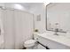 Clean bathroom with shower curtain, white vanity, and modern mirror at 29798 N 121St Dr, Peoria, AZ 85383