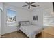 Bright bedroom with neutral walls, tile floors, and a ceiling fan at 29798 N 121St Dr, Peoria, AZ 85383