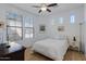 Bright bedroom with neutral walls, tile floors, and a ceiling fan at 29798 N 121St Dr, Peoria, AZ 85383