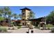 Gorgeous community clubhouse and entrance area, with meticulous landscaping and shaded seating, for relaxing and enjoying the outdoors at 29798 N 121St Dr, Peoria, AZ 85383