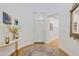 Bright foyer with a round rug and decorations on the console table at 29798 N 121St Dr, Peoria, AZ 85383