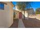 Inviting front entrance with desert landscaping and a pink front door at 29798 N 121St Dr, Peoria, AZ 85383