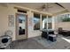 Inviting covered patio with outdoor seating and ceiling fan at 29798 N 121St Dr, Peoria, AZ 85383