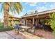 Backyard features a dining table and a covered patio with an outdoor kitchen at 3146 W Paradise Dr, Phoenix, AZ 85029