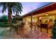 Expansive backyard patio with tile flooring, outdoor dining, and covered seating area at 3146 W Paradise Dr, Phoenix, AZ 85029