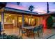 Wide backyard patio featuring tile, outdoor bar, dining area, and access to the home's interior at 3146 W Paradise Dr, Phoenix, AZ 85029