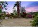 Large backyard featuring mature landscaping, providing a private and serene outdoor space at 3146 W Paradise Dr, Phoenix, AZ 85029