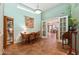 Bright dining room with a skylight, a china cabinet, and glass doors to another room at 3146 W Paradise Dr, Phoenix, AZ 85029