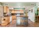 Well-lit kitchen with wooden cabinets, a center island, and sleek countertops at 3146 W Paradise Dr, Phoenix, AZ 85029