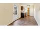 Cozy kitchenette with a compact layout, complete with a mini fridge and microwave, under cabinet lighting and tiled flooring at 3146 W Paradise Dr, Phoenix, AZ 85029