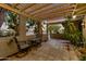 Inviting front patio area with cozy seating and wooden pergola offering shade at 3146 W Paradise Dr, Phoenix, AZ 85029
