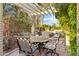 A backyard patio features a dining table and a view of the pool at 3146 W Paradise Dr, Phoenix, AZ 85029