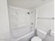 Clean bathroom featuring a shower-tub combination, a toilet, and a towel rack at 3420 W Danbury Dr # C218, Phoenix, AZ 85053
