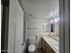 Bright bathroom with a tub-shower combo, toilet, vanity, and updated fixtures at 3420 W Danbury Dr # C218, Phoenix, AZ 85053
