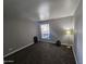 Bedroom featuring gray walls, neutral carpet, and a window for natural light at 3420 W Danbury Dr # C218, Phoenix, AZ 85053