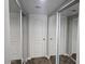 Bright hallway with multiple mirrored closet doors for ample storage, and plush carpeting at 3420 W Danbury Dr # C218, Phoenix, AZ 85053