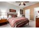 Comfortable bedroom with a large bed, soft carpet, and a serene atmosphere for restful nights at 3830 E Lakewood Pkwy # 1057, Phoenix, AZ 85048