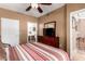 Cozy bedroom with a ceiling fan and a dresser with a TV at 3830 E Lakewood Pkwy # 1057, Phoenix, AZ 85048