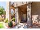 Exterior view of the building entrance with well-maintained landscaping and stairs leading up at 3830 E Lakewood Pkwy # 1057, Phoenix, AZ 85048