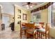 Charming dining area with tile flooring, warm lighting, and seating for six people at 3830 E Lakewood Pkwy # 1057, Phoenix, AZ 85048