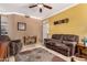 Inviting living room features tile floors, plush furniture, and a soothing color palette at 3830 E Lakewood Pkwy # 1057, Phoenix, AZ 85048