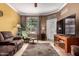 Comfortable living room featuring a relaxing chair, plush sofa, and neutral wall colors at 3830 E Lakewood Pkwy # 1057, Phoenix, AZ 85048