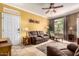 Inviting living room with neutral walls, tile flooring, and comfortable seating arrangement near the entry at 3830 E Lakewood Pkwy # 1057, Phoenix, AZ 85048