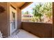 Inviting patio area with views of the manicured landscaping and surrounding buildings at 3830 E Lakewood Pkwy # 1057, Phoenix, AZ 85048