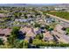 Panoramic aerial view of the neighborhood with mature landscaping and stunning mountain views at 3949 E Norcroft Cir, Mesa, AZ 85215