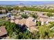 Expansive backyard with a sparkling pool, covered patio, and lush greenery surrounding the home and creating a private retreat at 3949 E Norcroft Cir, Mesa, AZ 85215