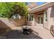 Private backyard patio with a fire pit and access to the home's French doors at 3949 E Norcroft Cir, Mesa, AZ 85215