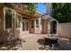 Cozy backyard with stone firepit, arbor and access to home's French doors at 3949 E Norcroft Cir, Mesa, AZ 85215