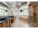 A luxurious bathroom features a bathtub, shower, and double sinks at 3949 E Norcroft Cir, Mesa, AZ 85215