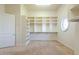 A walk-in closet features shelving at 3949 E Norcroft Cir, Mesa, AZ 85215