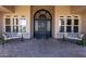 Elegant front entryway with decorative door, large windows, and inviting bench seating at 3949 E Norcroft Cir, Mesa, AZ 85215