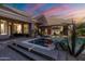 A Luxurious hot tub with ample patio space and tropical landscaping at 3949 E Norcroft Cir, Mesa, AZ 85215