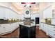 Spacious kitchen with a large island, custom cabinetry, and modern appliances at 3949 E Norcroft Cir, Mesa, AZ 85215