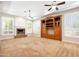 Spacious living room with coffered ceiling, fireplace, and large built-in entertainment center at 3949 E Norcroft Cir, Mesa, AZ 85215