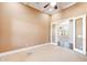 Versatile office space with double doors, neutral paint, a ceiling fan, and well-maintained carpet at 3949 E Norcroft Cir, Mesa, AZ 85215