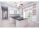 Spacious office featuring custom built-ins, granite countertops, and additional storage cabinetry at 3949 E Norcroft Cir, Mesa, AZ 85215