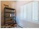 Storage room with shelving, utility sink, and a window for natural light at 3949 E Norcroft Cir, Mesa, AZ 85215