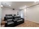 Home theater seating and a projector create an immersive entertainment experience at 3949 E Norcroft Cir, Mesa, AZ 85215