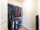 Functional walk-in closet featuring double hanging rods and ample storage for clothing and personal items at 3949 E Norcroft Cir, Mesa, AZ 85215