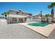 Enjoy the sparkling pool surrounded by desert landscaping and privacy walls at 4319 E Tanglewood Dr, Phoenix, AZ 85048