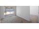Bedroom with sliding glass doors to the covered patio, neutral carpet, and white walls at 4319 E Tanglewood Dr, Phoenix, AZ 85048